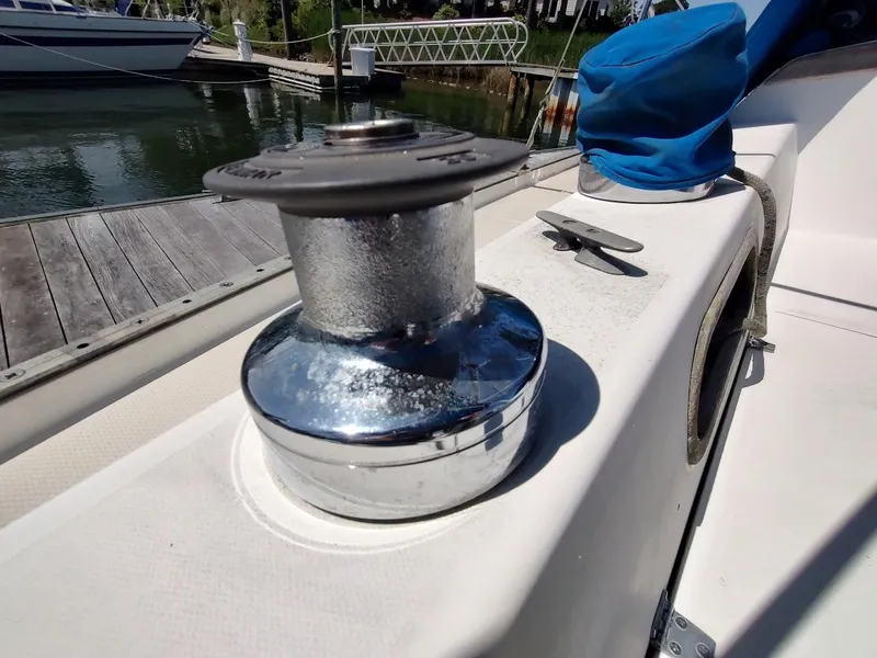 Slide: The Image of Close-up of a winch on a 1987 Catalina C-34 sailboat docked at a marina. - 22