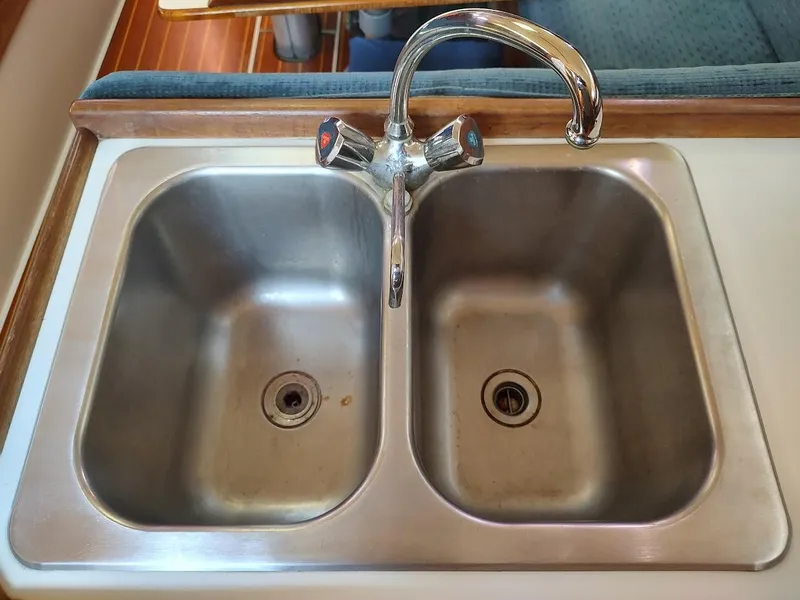 Slide: The Image of Double stainless steel sink with faucet on a 1987 Catalina C-34 boat. - 36