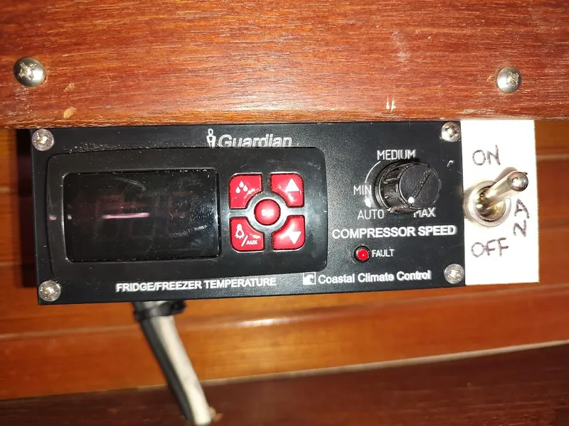 Slide: The Image of Control panel for fridge/freezer temperature on a 1987 Catalina C-34 boat. - 40
