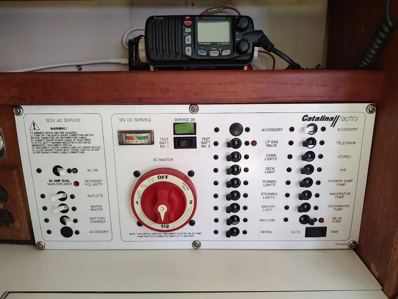 Slide: The Image of Electrical control panel of a 1987 Catalina C-34 yacht with various switches and gauges. - 43