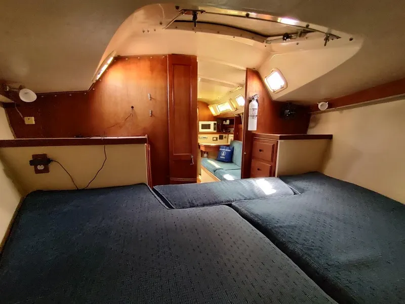 Slide: The Image of Interior of 1987 Catalina C-34 sailboat with cozy cabin and wooden furnishings. - 47
