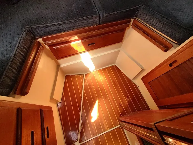 Slide: The Image of Interior of 1987 Catalina C-34 sailboat with wooden flooring and cabinetry. - 48