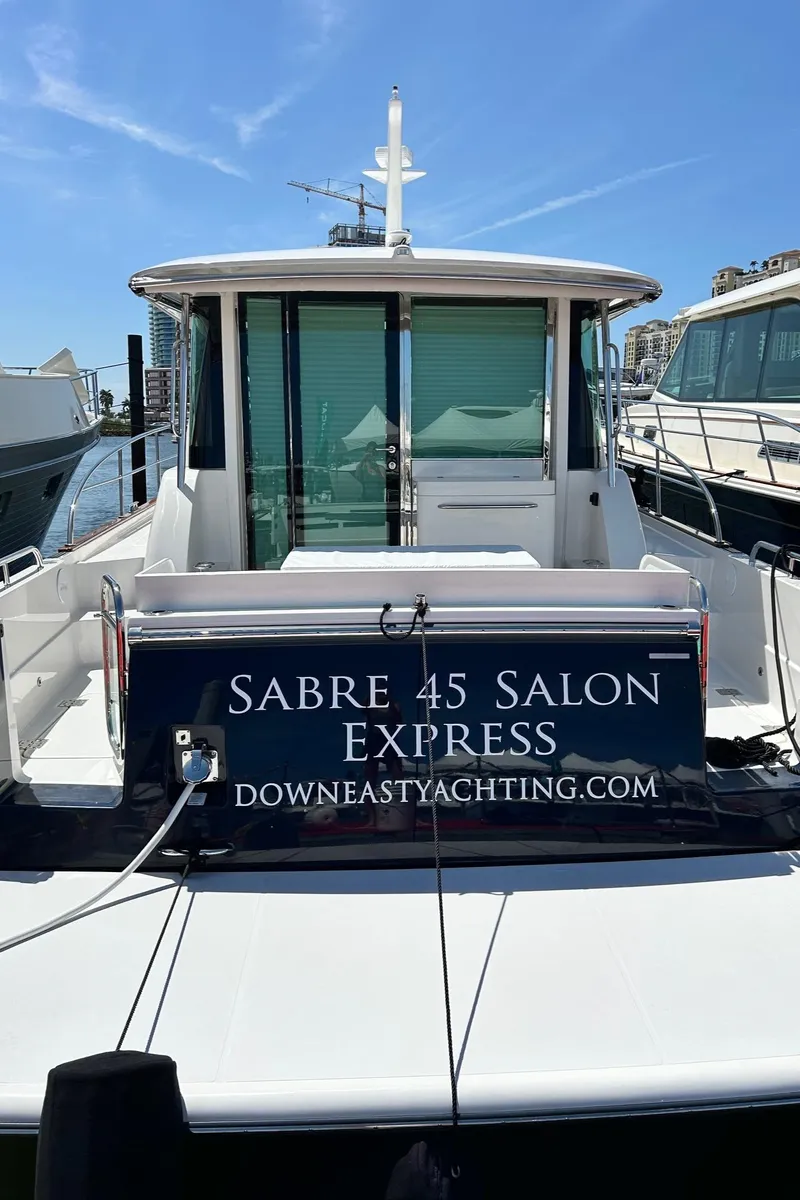 Slide: The Image of Luxurious interior of 2026 Sabre 45 Salon Express yacht with elegant seating and wooden accents. - 11