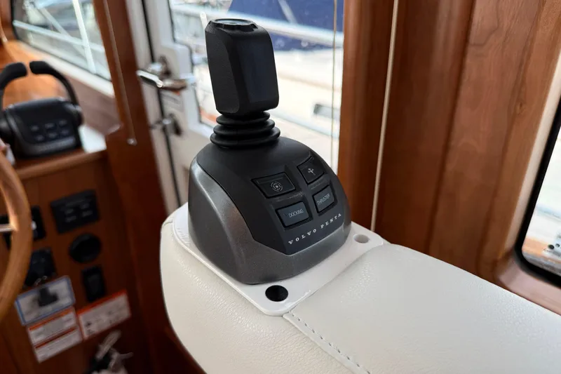 Slide: The Image of Joystick control on 2026 Sabre 45 Salon Express yacht, featuring Volvo Penta system. - 17