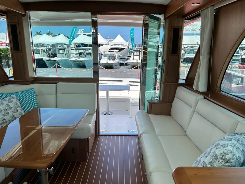 Slide: The Image of Outdoor kitchenette on 2026 Sabre 45 Salon Express yacht with sink and grill. - 4