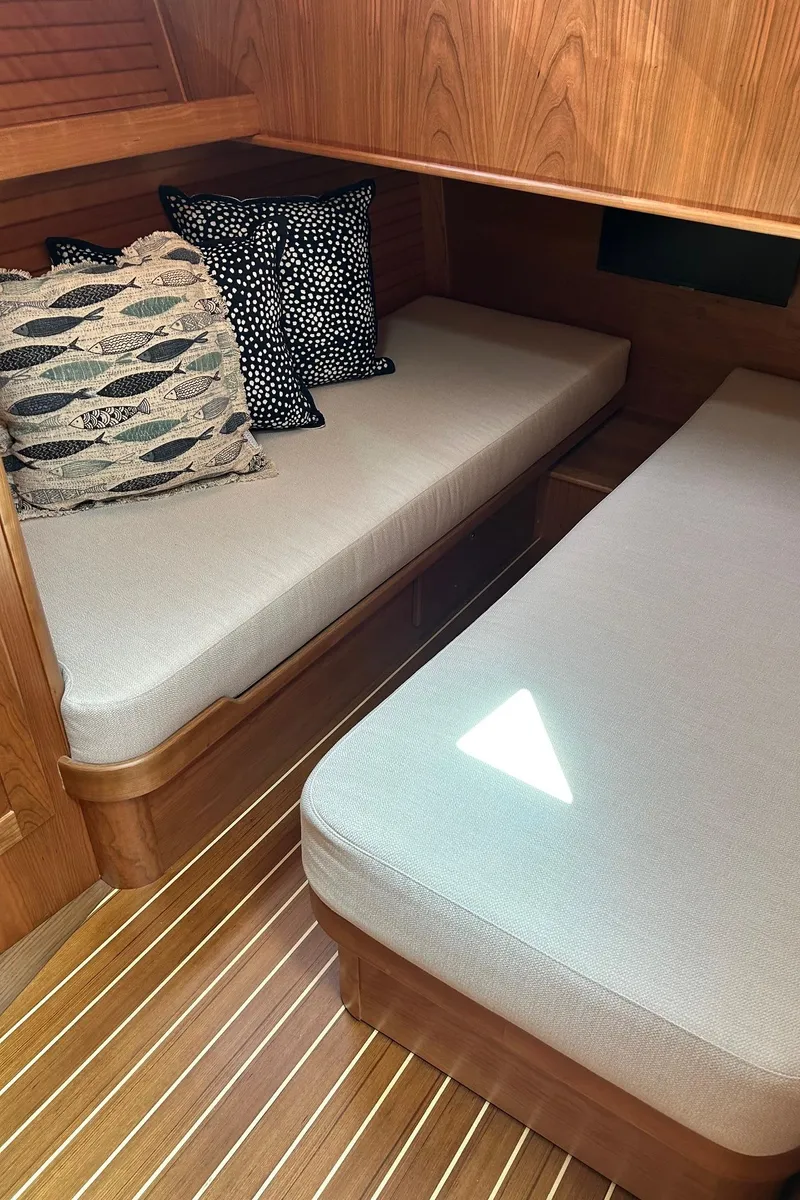 Slide: The Image of 2026 Sabre 45 Salon Express yacht docked at marina, featuring spacious outdoor seating. - 9