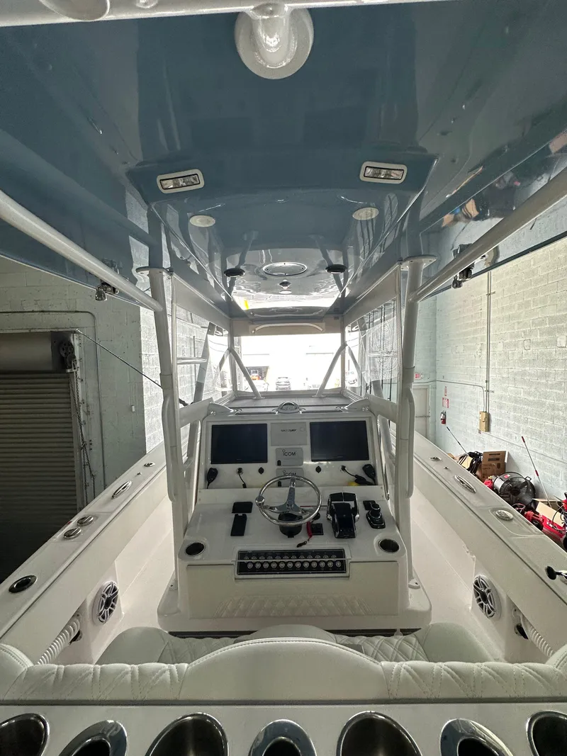 Slide: The Image of 2025 Invincible 36 Open boat interior with advanced navigation controls and sleek design. - 8