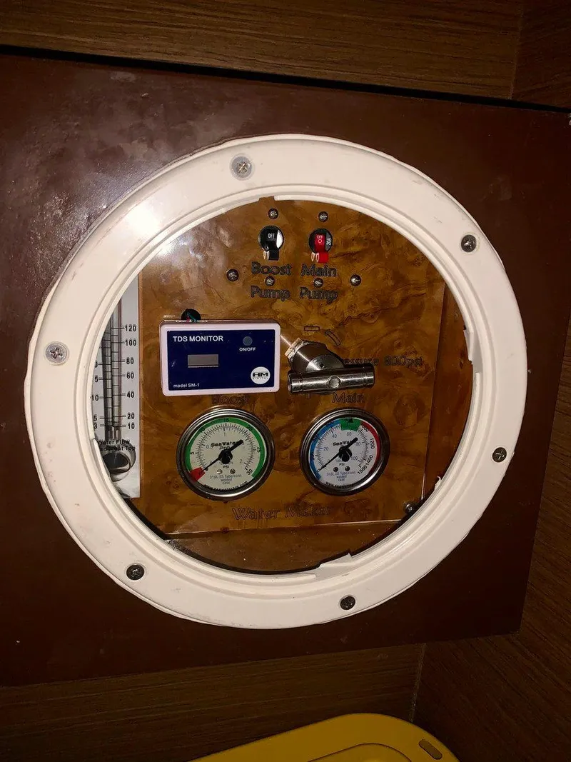 Slide: The Image of Control panel of a 2019 Lagoon 380 S2 4/2 yacht with gauges and switches. - 14