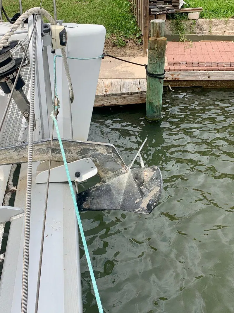 Slide: The Image of 2019 Lagoon 380 S2 4/2 catamaran docked with anchor visible. - 15