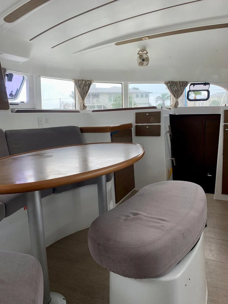 Slide: The Image of Interior of 2019 Lagoon 380 S2 4/2 catamaran with dining area and seating. - 17