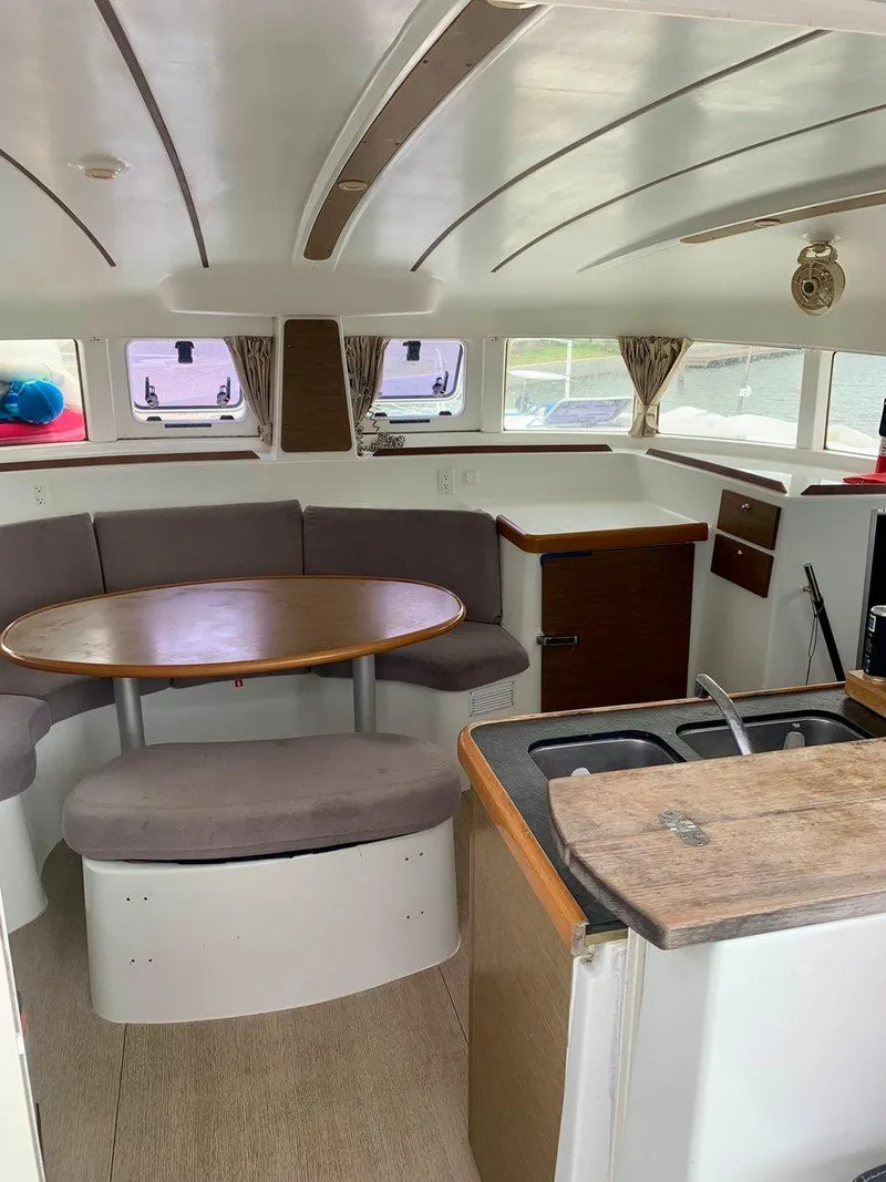 Slide: The Image of Interior of 2019 Lagoon 380 S2 4/2 catamaran with dining area and kitchenette. - 24
