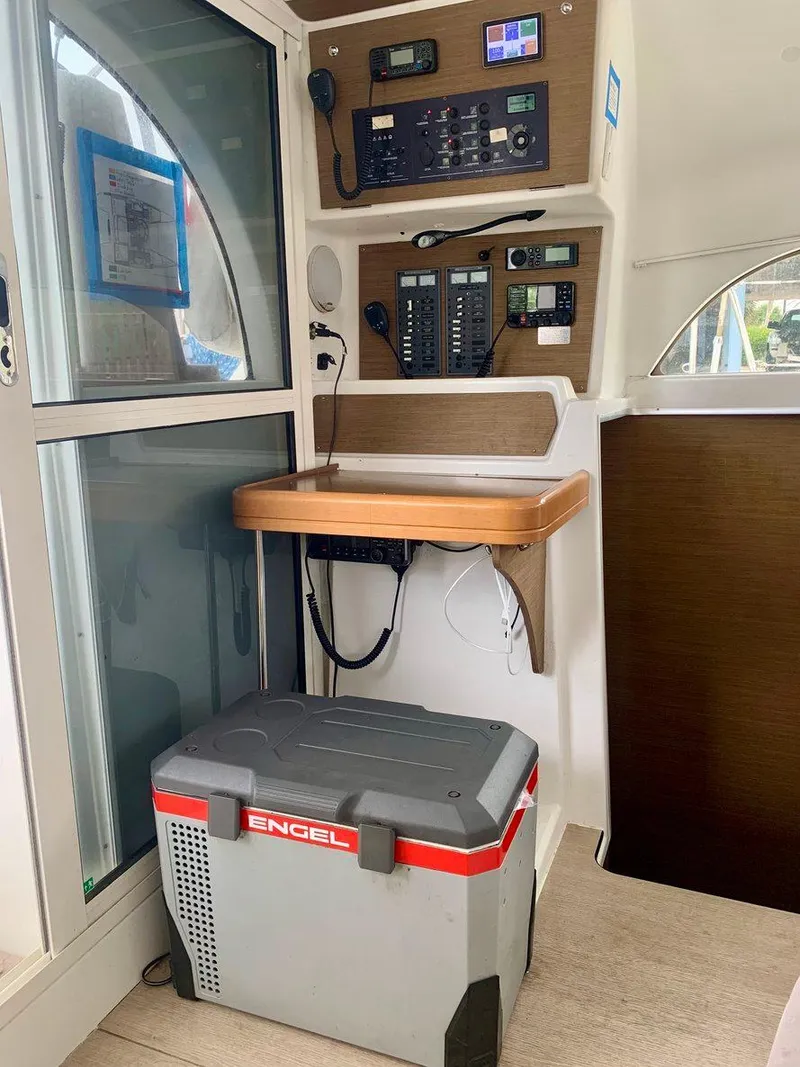 Slide: The Image of Lagoon 380 S2 4/2 2019 yacht interior with control panel and Engel cooler. - 26