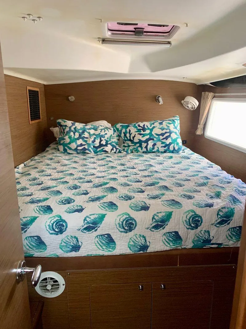Slide: The Image of Cozy bedroom in 2019 Lagoon 380 S2 yacht with seashell-themed bedding. - 30