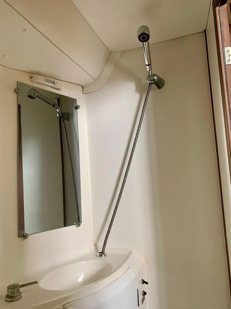 Slide: The Image of Bathroom interior of 2019 Lagoon 380 S2 4/2 yacht with shower and mirror. - 34