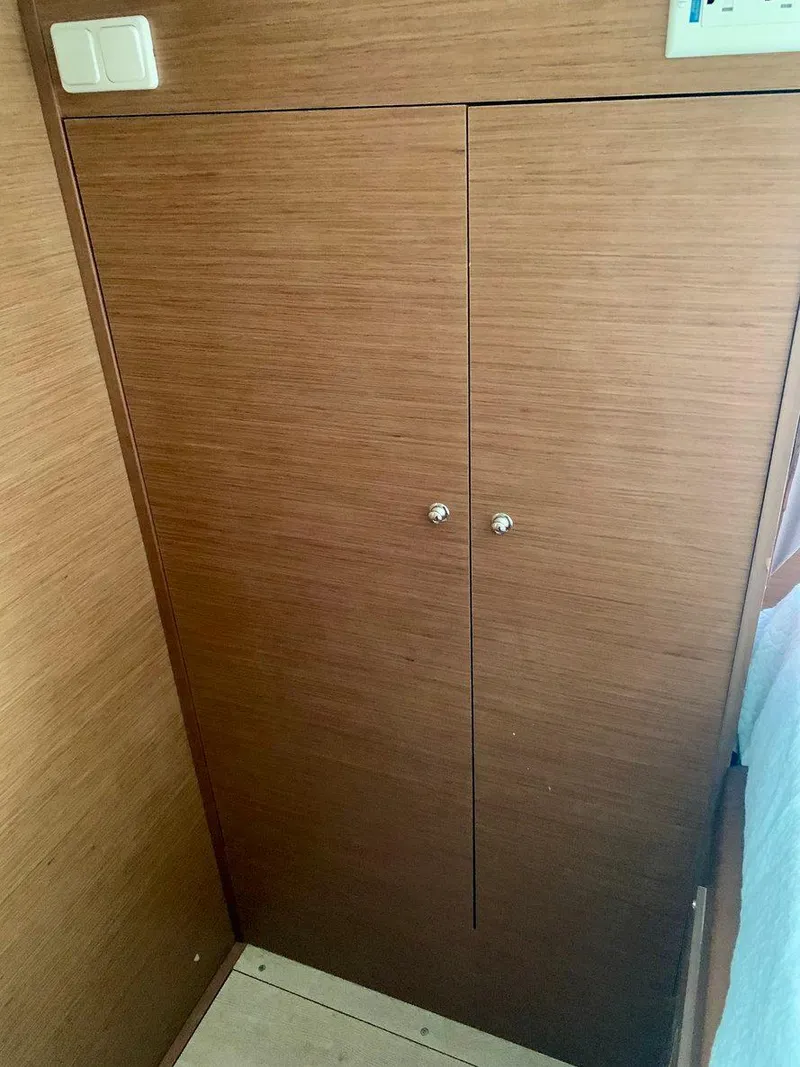 Slide: The Image of Wooden cabinet doors inside 2019 Lagoon 380 S2 4/2 yacht interior. - 37