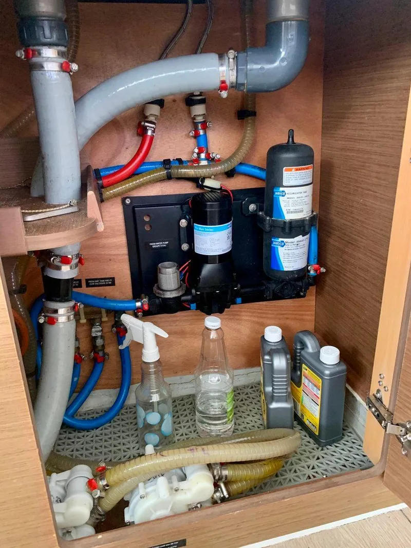 Slide: The Image of Plumbing system inside Lagoon 380 S2 4/2 yacht, 2019 model, with maintenance supplies. - 39