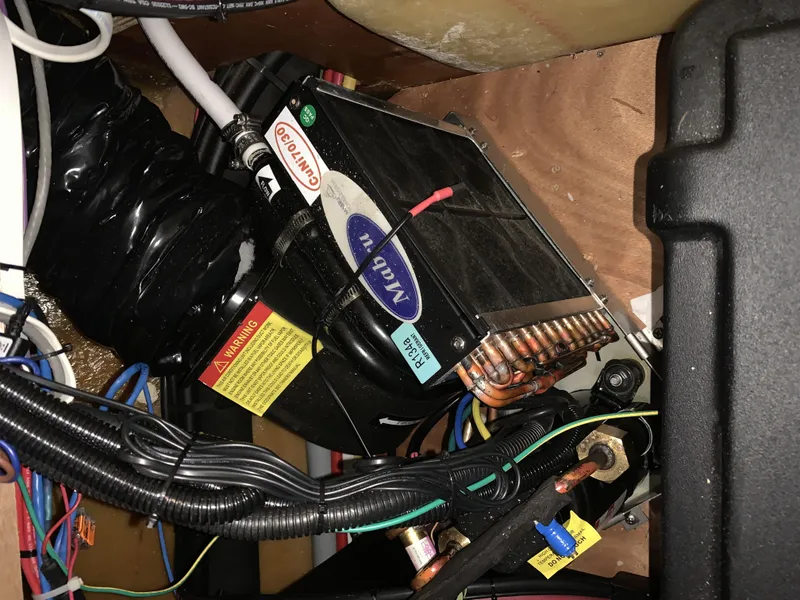 Slide: The Image of Electrical components inside a 2019 Lagoon 380 S2 4/2 yacht. - 49