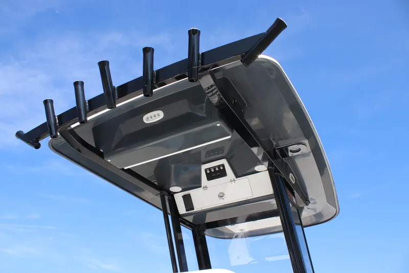 Slide: The Image of T-top of 2025 Sea Fox 251 Bay Fox boat against clear blue sky. - 14