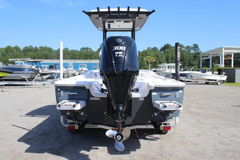 Slide: The Image of 2025 Sea Fox 251 Bay Fox boat with powerful 300 V6 engine, displayed outdoors. - 2
