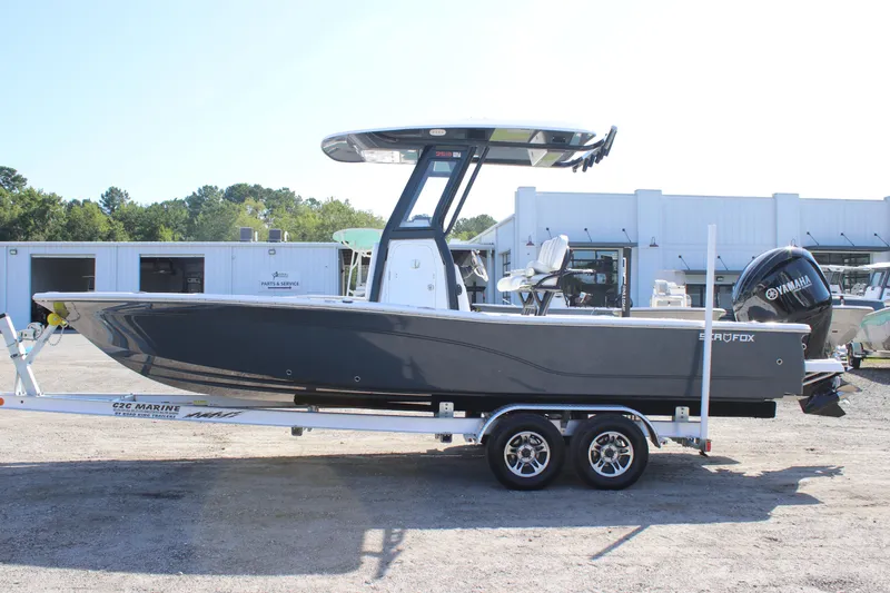 Slide: The Image of 2025 Sea Fox 251 Bay Fox boat on trailer, parked outdoors. - 4