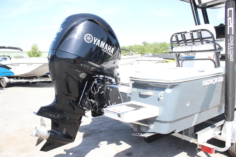 Slide: The Image of 2025 Sea Fox 251 Bay Fox with Yamaha outboard motor at a marina. - 5