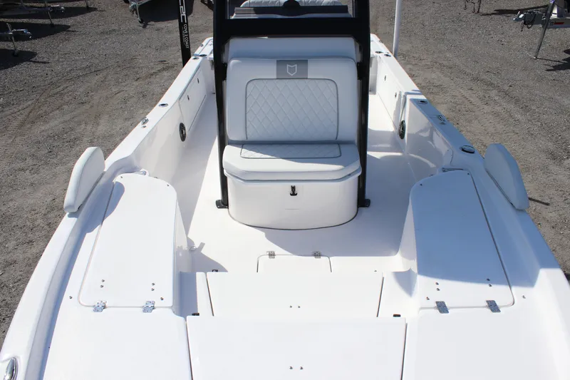 Slide: The Image of 2025 Sea Fox 251 Bay Fox boat interior with white seating and storage compartments. - 6