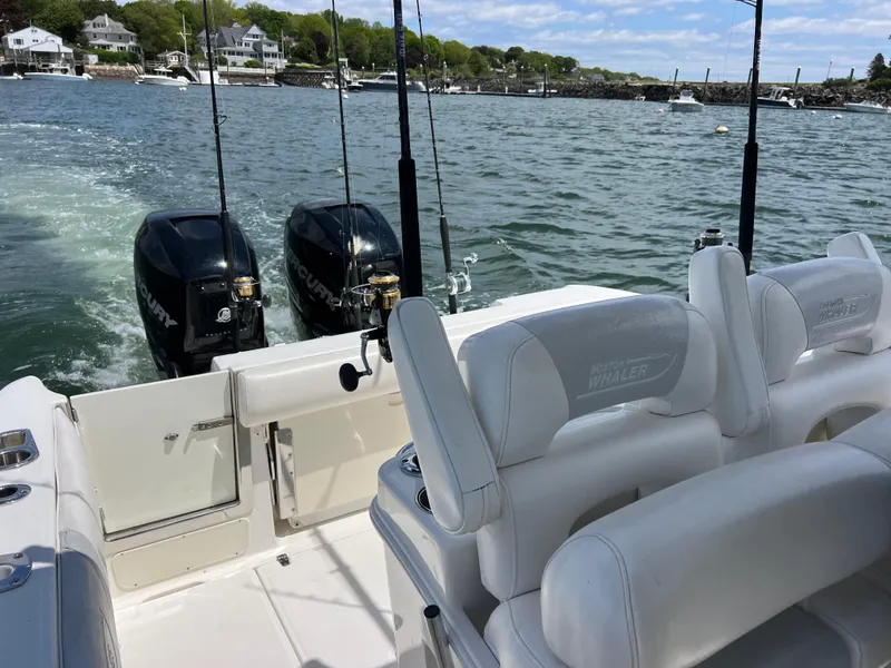 Slide: The Image of 2012 Boston Whaler 280 Outrage boat with twin engines on a scenic waterway. - 3