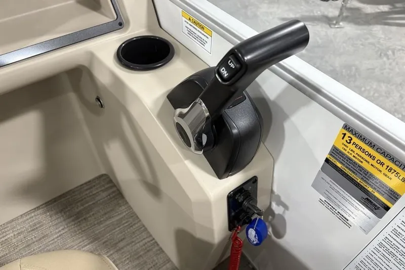 Slide: The Image of Control panel of 2025 Godfrey Xperience 2286 SBX Sport Tube boat, featuring throttle and capacity label. - 15
