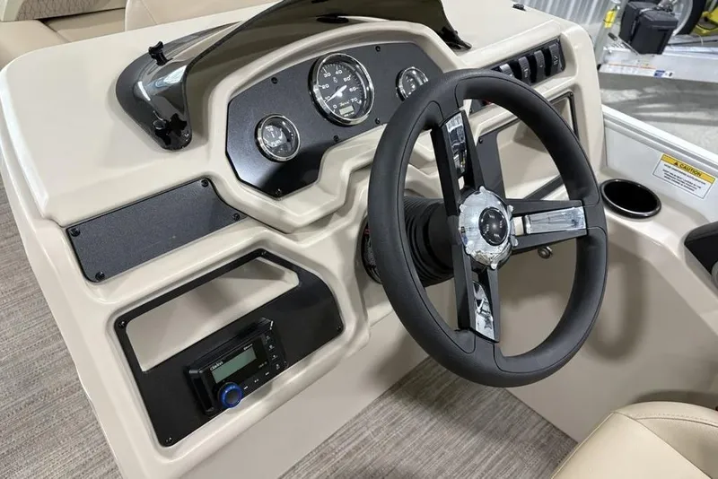 Slide: The Image of Steering console of 2025 Godfrey Xperience 2286 SBX Sport Tube boat, featuring modern controls. - 18