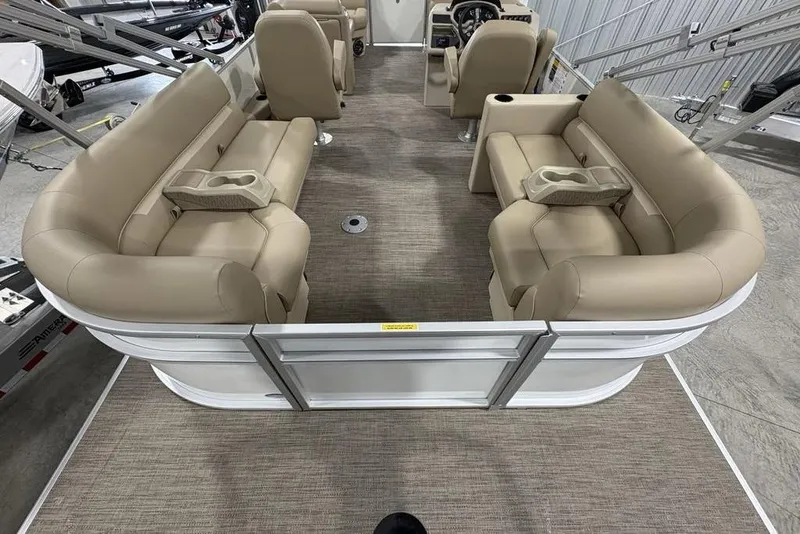 Slide: The Image of 2025 Godfrey Xperience 2286 SBX Sport Tube interior with beige seating and cup holders. - 29