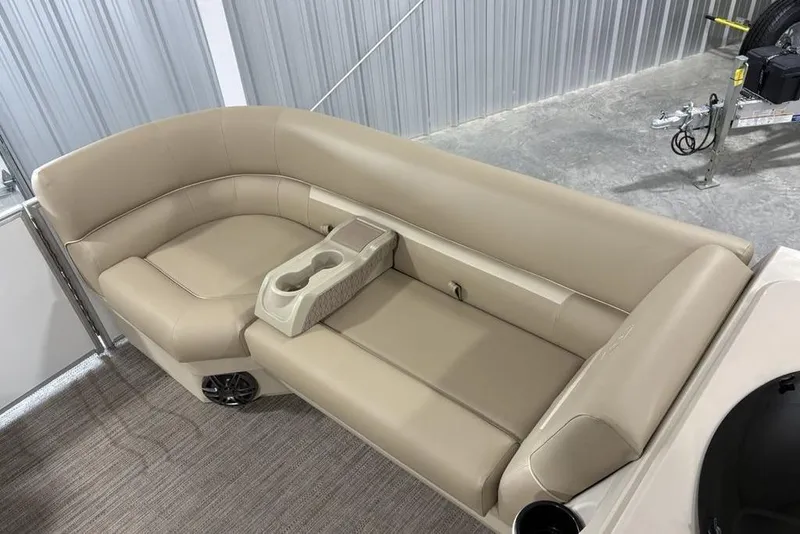 Slide: The Image of Luxurious seating on 2025 Godfrey Xperience 2286 SBX Sport Tube boat, featuring beige upholstery. - 3