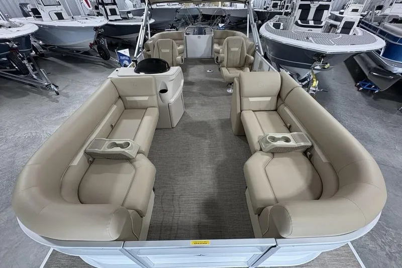 Slide: The Image of 2025 Godfrey Xperience 2286 SBX Sport Tube pontoon boat with beige seating in showroom. - 30