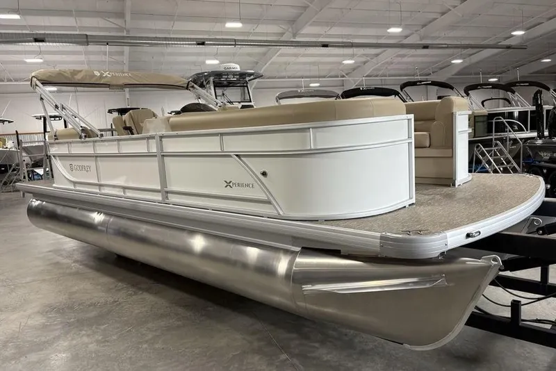 Slide: The Image of 2025 Godfrey Xperience 2286 SBX Sport Tube pontoon boat in showroom, side view. - 1