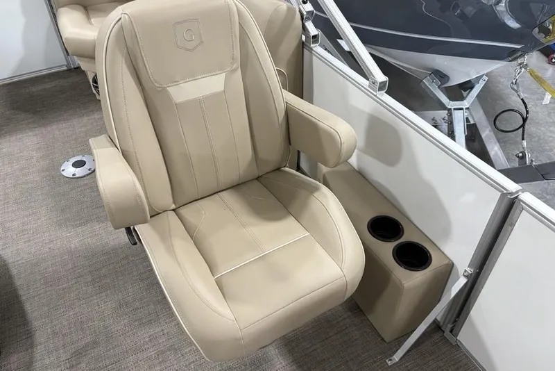 Slide: The Image of Beige captain's chair on 2025 Godfrey Xperience 2286 SBX Sport Tube boat, with cup holders. - 16
