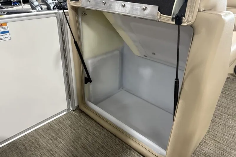 Slide: The Image of Open storage compartment in 2025 Godfrey Xperience 2286 SBX Sport Tube boat. - 19