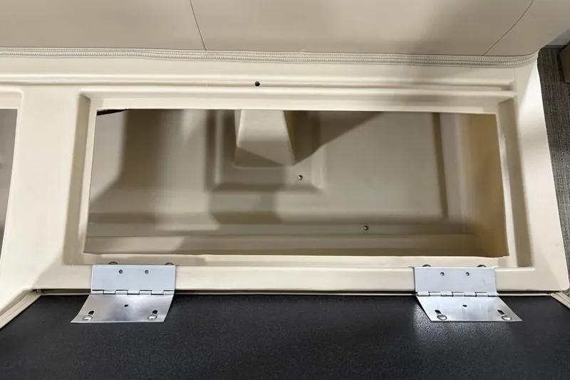 Slide: The Image of Open storage compartment in 2025 Godfrey Xperience 2286 SBX Sport Tube boat. - 22