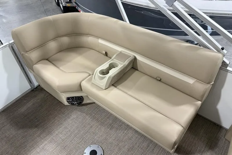 Slide: The Image of Beige seating on 2025 Godfrey Xperience 2286 SBX Sport Tube boat, featuring cup holders. - 25