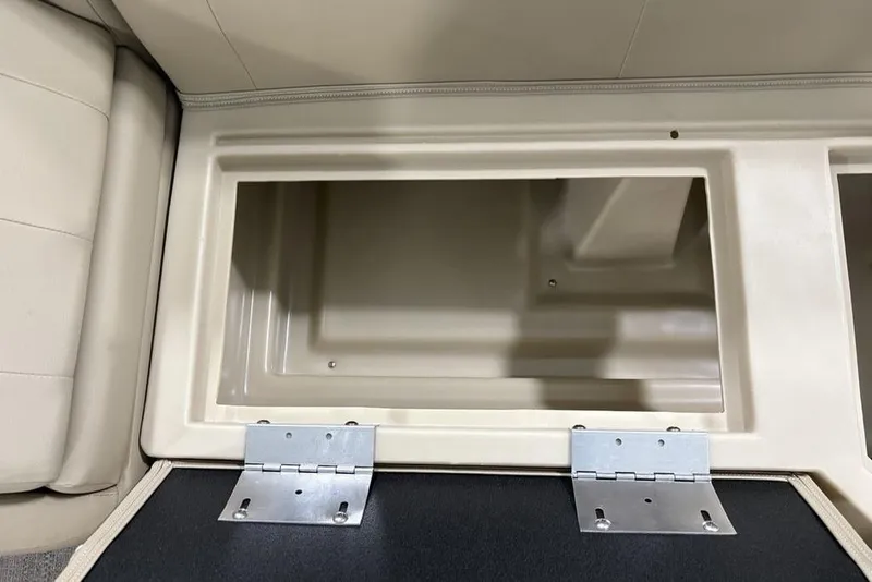 Slide: The Image of Open storage compartment in 2025 Godfrey Xperience 2286 SBX Sport Tube boat. - 9