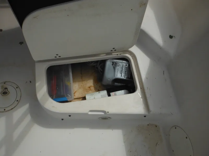 Slide: The Image of 1997 Pro-Line 231 WA storage compartment with various items inside. - 18