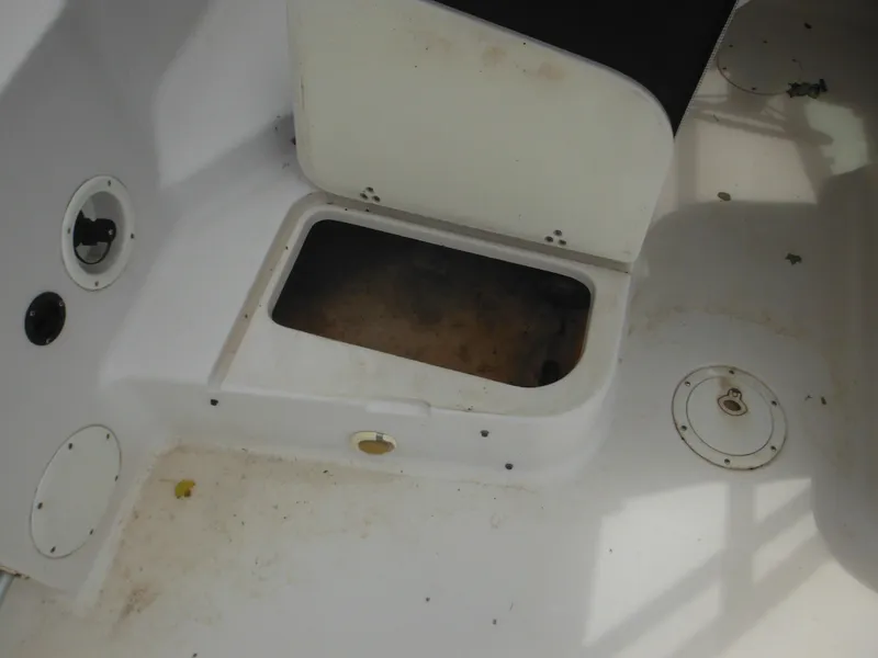 Slide: The Image of Open storage compartment on 1997 Pro-Line 231 WA boat deck. - 19