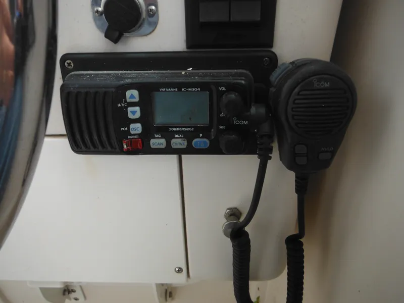 Slide: The Image of 1997 Pro-Line 231 WA boat radio and microphone setup. - 29