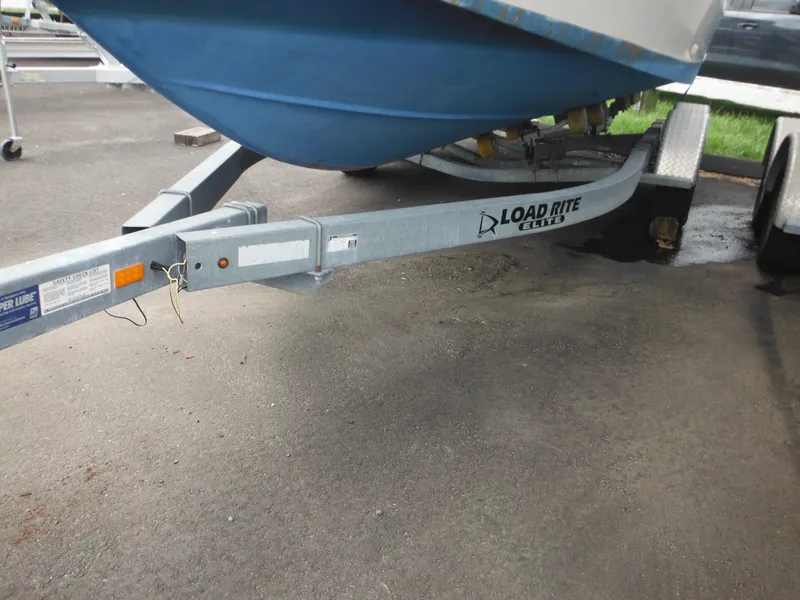 Slide: The Image of Trailer for 1997 Pro-Line 231 WA boat, featuring Load Rite branding. - 3