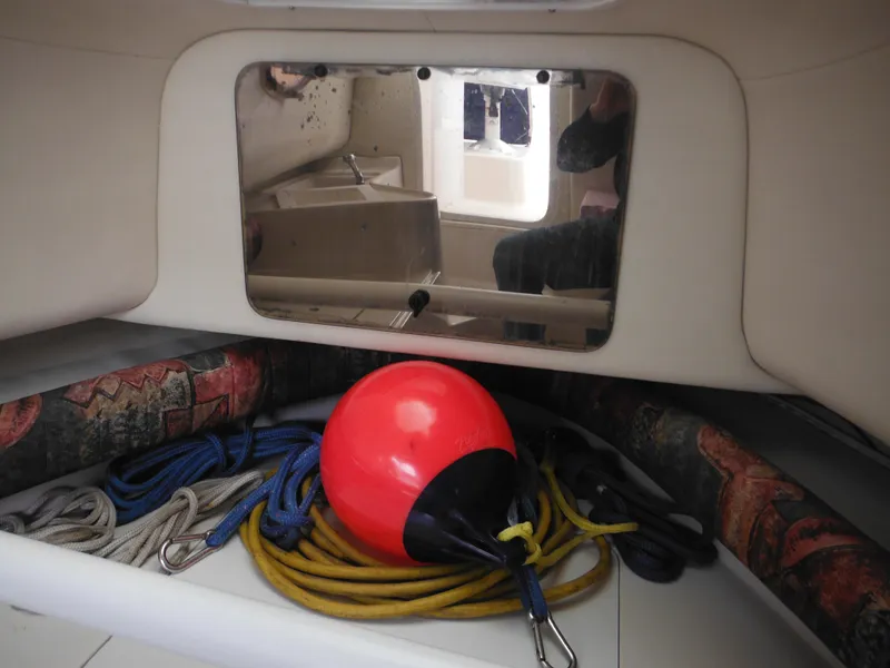 Slide: The Image of Interior of 1997 Pro-Line 231 WA boat with ropes and buoy. - 34