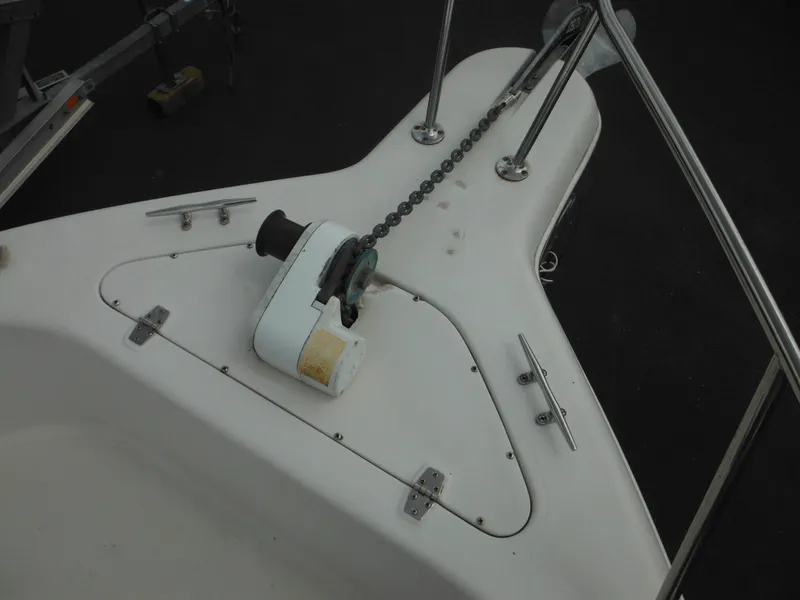 Slide: The Image of 1997 Pro-Line 231 WA boat anchor system with chain and winch on deck. - 43