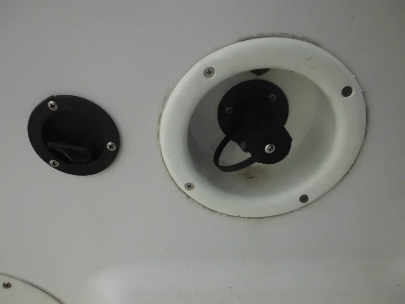 Slide: The Image of Close-up of a 1997 Pro-Line 231 WA boat's fuel cap and vent. - 46