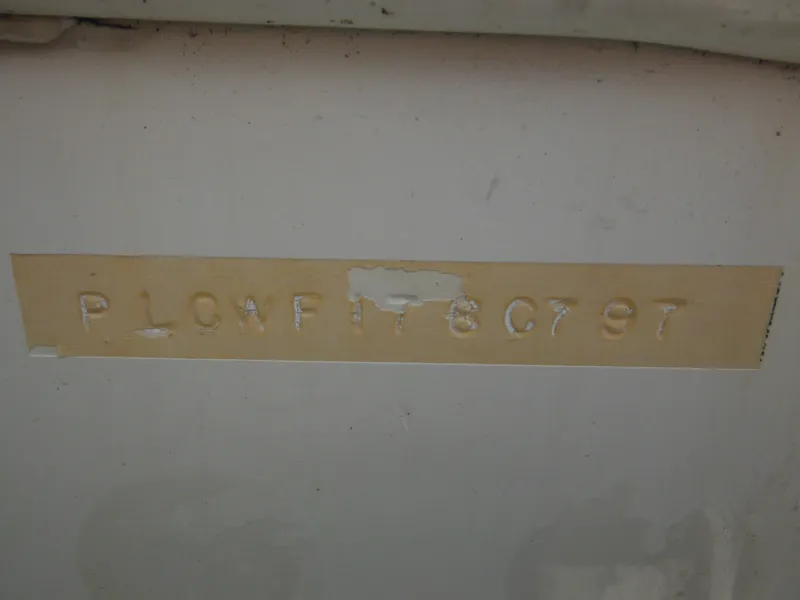 Slide: The Image of 1997 Pro-Line 231 WA boat hull identification number on beige background. - 8
