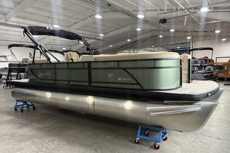 The Image of 2025 Godfrey Xperience 2286 SBX pontoon boat in showroom, featuring iMPACT Center Tube Package. - 0