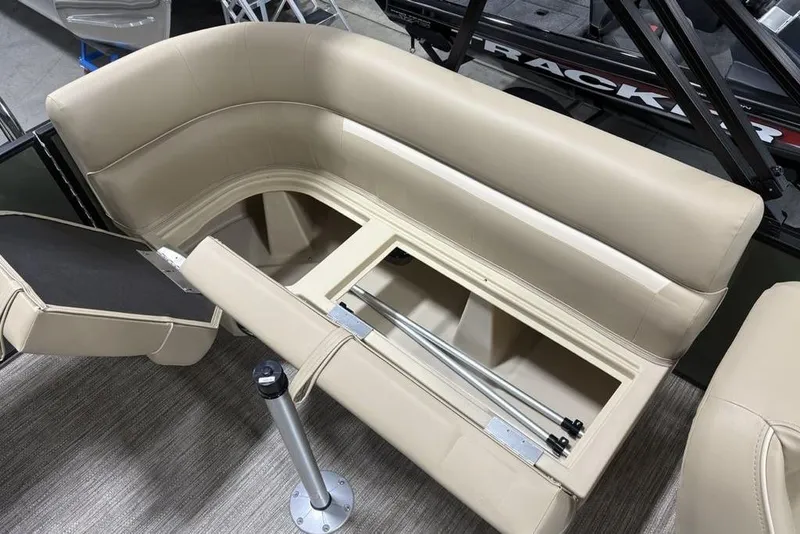 Slide: The Image of 2025 Godfrey Xperience 2286 SBX boat seating with storage compartment open. - 10