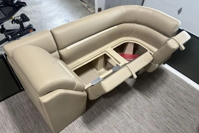Slide: The Image of 2025 Godfrey Xperience 2286 SBX boat seating with storage, beige upholstery, open compartment. - 13