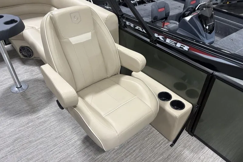 Slide: The Image of Beige captain's chair on 2025 Godfrey Xperience 2286 SBX boat, featuring cup holders. - 15